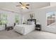 Spacious main bedroom with tray ceiling, large windows, and neutral tones at 3242 Monarch Pine Dr, Peachtree Corners, GA 30071