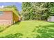 Backyard with grassy area and shed at 4447 Ben Hill Rd, Lithia Springs, GA 30122