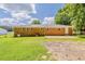 Brick home's backyard with grassy area and a small patio at 4447 Ben Hill Rd, Lithia Springs, GA 30122
