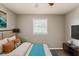 Relaxing bedroom featuring a comfortable bed, and a view to the window at 4447 Ben Hill Rd, Lithia Springs, GA 30122