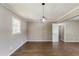 Spacious bedroom with hardwood flooring, featuring a modern ceiling light at 4447 Ben Hill Rd, Lithia Springs, GA 30122