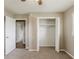 Neutral bedroom features a standard closet with bi-fold doors at 4447 Ben Hill Rd, Lithia Springs, GA 30122