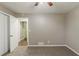 Bedroom featuring neutral paint, carpet, and access to an en suite bathroom and closet space at 4447 Ben Hill Rd, Lithia Springs, GA 30122