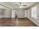 Spacious room with hardwood floors, neutral walls and a ceiling fan at 4447 Ben Hill Rd, Lithia Springs, GA 30122