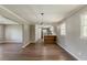 Open dining area with hardwood floors that leads into a modern kitchen space at 4447 Ben Hill Rd, Lithia Springs, GA 30122