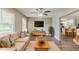 Comfortable living room featuring hardwood floors, a ceiling fan, and natural lighting at 4447 Ben Hill Rd, Lithia Springs, GA 30122