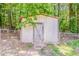 Backyard shed with concrete floor and wood door at 4447 Ben Hill Rd, Lithia Springs, GA 30122
