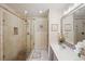 Well-appointed bathroom featuring a seamless glass shower, updated vanity, and stylish finishes at 4467 Pineridge Cir, Atlanta, GA 30338
