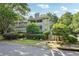 Charming multi-Gathering home with a screened porch and lush landscaping, perfect for relaxing and enjoying the outdoors at 4467 Pineridge Cir, Atlanta, GA 30338