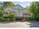 Attractive condo building with covered parking, landscaped grounds, and inviting front porches at 4467 Pineridge Cir, Atlanta, GA 30338