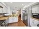 Open kitchen showcasing granite counters, stainless appliances and fixtures, and direct access to living spaces at 4467 Pineridge Cir, Atlanta, GA 30338