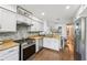 Modern kitchen with granite countertops, stainless steel appliances, ample storage, and convenient breakfast bar at 4467 Pineridge Cir, Atlanta, GA 30338