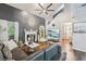 Elegant living room with vaulted ceilings, hardwood flooring, fireplace, and a serene screened porch at 4467 Pineridge Cir, Atlanta, GA 30338