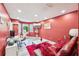 Living room features a modern table, a leather sofa, and red decor at 4467 Pineridge Cir, Atlanta, GA 30338