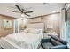 A spacious primary bedroom includes a seating area, large window, ceiling fan and neutral paint at 4467 Pineridge Cir, Atlanta, GA 30338
