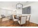 Cozy dining area with a modern chandelier, hardwood floors, and comfortable seating at 834 Heritage Sq, Decatur, GA 30033