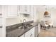 Stylish kitchen featuring granite countertops and a breakfast nook with natural lighting at 834 Heritage Sq, Decatur, GA 30033
