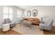 Elegant living area featuring hardwood floors, modern furnishings, and stylish decor at 834 Heritage Sq, Decatur, GA 30033