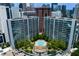Aerial view of building complex with a beautiful outdoor pool and lush greenery at 950 Nw W Peachtree Nw St # 410, Atlanta, GA 30309