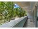 Balcony features a concrete railing and view of tree-lined street at 950 Nw W Peachtree Nw St # 410, Atlanta, GA 30309