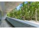 Balcony overlooking lush green trees and a charming street view from above at 950 Nw W Peachtree Nw St # 410, Atlanta, GA 30309