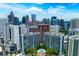 Building with cityscape view, pool, and well-maintained landscaping at 950 Nw W Peachtree Nw St # 410, Atlanta, GA 30309