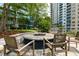 Community outdoor fire pit area with seating and a view of the building at 950 Nw W Peachtree Nw St # 410, Atlanta, GA 30309