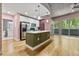 Open kitchen featuring a breakfast bar island, stainless steel appliances, and modern finishes at 950 Nw W Peachtree Nw St # 410, Atlanta, GA 30309