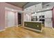 Modern kitchen features an island, stainless steel appliances, and white cabinets at 950 Nw W Peachtree Nw St # 410, Atlanta, GA 30309