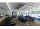Relaxing lounge area featuring a kitchenette, comfortable seating, and large windows with views of the community pool at 950 Nw W Peachtree Nw St # 410, Atlanta, GA 30309