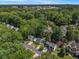An aerial view shows a quiet, leafy neighborhood with well-maintained homes and mature trees, creating a peaceful atmosphere at 1175 Haven Brook Way, Atlanta, GA 30319