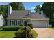Inviting home features manicured landscaping, a two-car garage, and classic architectural details at 1175 Haven Brook Way, Atlanta, GA 30319