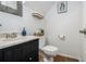 Cozy half bathroom featuring toilet, sink and wood floors at 1175 Haven Brook Way, Atlanta, GA 30319