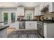 Modern kitchen with stainless steel appliances, white cabinets, and access to deck at 1175 Haven Brook Way, Atlanta, GA 30319