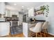Modern kitchen with white cabinets, breakfast bar, and stainless-steel appliances at 1175 Haven Brook Way, Atlanta, GA 30319