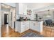 Stylish eat-in kitchen with white cabinets, modern appliances, and hardwood floors at 1175 Haven Brook Way, Atlanta, GA 30319