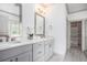 Bright bathroom featuring double sinks, quartz countertops, and modern fixtures at 1216 Virginia Ne Ct # 8, Atlanta, GA 30306