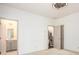 Bedroom with neutral carpet and doors leading to a bathroom and staircase at 1216 Virginia Ne Ct # 8, Atlanta, GA 30306