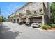 Townhome exterior with brick facade, individual balconies, and attached garages at 1216 Virginia Ne Ct # 8, Atlanta, GA 30306