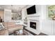 Living room features a cozy fireplace and is open to the modern kitchen at 1216 Virginia Ne Ct # 8, Atlanta, GA 30306