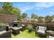 Inviting outdoor patio area perfect for relaxation and entertaining with grill at 1216 Virginia Ne Ct # 8, Atlanta, GA 30306