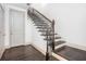 Dark-stained staircase with white risers, wrought iron railing, and a light-colored door at 1216 Virginia Ne Ct # 8, Atlanta, GA 30306