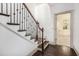 Dark-stained staircase with white risers and wrought iron railing at 1216 Virginia Ne Ct # 8, Atlanta, GA 30306