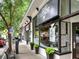 Storefront view of a commercial building with glass windows and outdoor seating at 1216 Virginia Ne Ct # 8, Atlanta, GA 30306