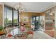 Bright breakfast nook features large windows, a modern chandelier and beautiful views to enjoy with your morning coffee at 2660 Peachtree Nw Rd # 10H, Atlanta, GA 30305