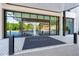 Elegant building entrance with glass doors, a branded welcome mat, and sleek modern design, inviting visitors at 2660 Peachtree Nw Rd # 10H, Atlanta, GA 30305