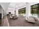 Bright common area with ample seating, large windows overlooking a pool, and modern decor at 2660 Peachtree Nw Rd # 10H, Atlanta, GA 30305