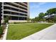 Well-manicured green space next to the building, providing a tranquil outdoor area for residents at 2660 Peachtree Nw Rd # 10H, Atlanta, GA 30305