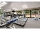 Modern gym with treadmills, weights, and large windows providing natural light and views during workouts at 2660 Peachtree Nw Rd # 10H, Atlanta, GA 30305