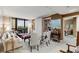 Cozy living room with built-in bookshelves, large windows, and neutral decor at 2660 Peachtree Nw Rd # 10H, Atlanta, GA 30305